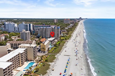 Bird's eye view of unending shoreline and a pool