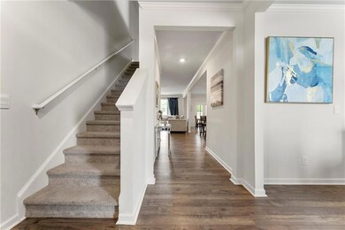 Staircase featuring hardwood / wood-style floors a