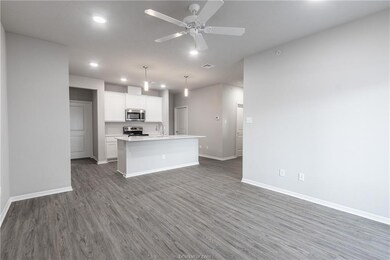 Kitchen with dark hardwood / wood-style floors, de