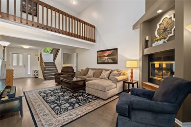 Hardwood Floors And A Log Burning Fireplace Are Fe