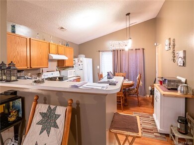 KITCHEN/BREAKFAST AREA WITH PANTRY. EXITS TO BACK 