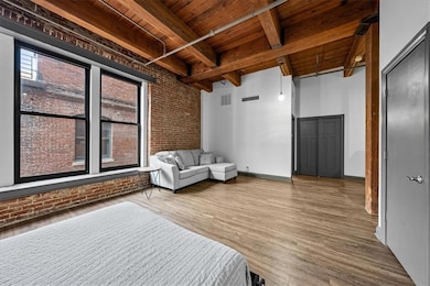 Love the LOFT w/BIG Beams & Brick Exterior