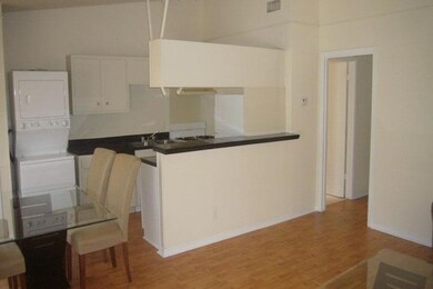 Kitchen featuring stacked washer / drying machine