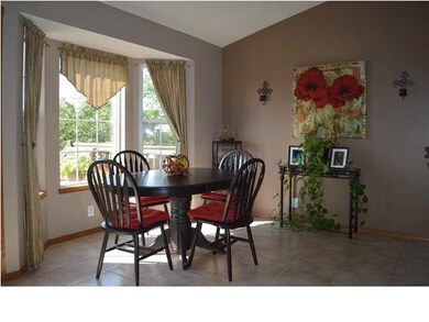 Spacious kitchen with tile floor.