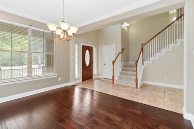 Entrance foyer featuring hardwood / wood-style fl