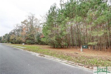 This homesite has a wooded buffer of land across f
