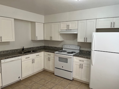 White Shaker Cabinets and Granite Countertops
