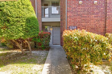 A covered patio and brick exterior are two of the 