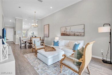 Living area featuring wood finish floors, baseboar