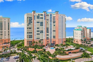 View of apartment building / complex featuring a water view