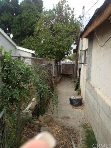 Sideyard with dog run.