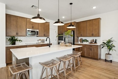 Kitchen with center island and pendant lighting