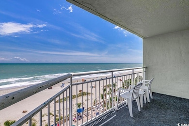 Balcony with a beach view and a water view