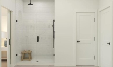 Primary bath with glass shower enclosure
