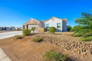 Single story home featuring stone siding, concrete