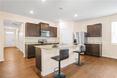 Kitchen with appliances with stainless steel finis