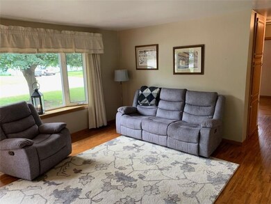 Living room, newer wood flooring.  Hall to bedroom