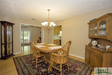 Dining room with wood floors.