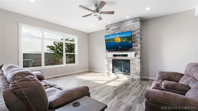 Beautiful fireplace accented by stone