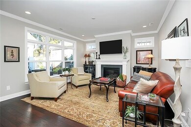 Living room with fireplace and windows overlooking