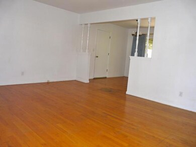 Family room with wood floors.