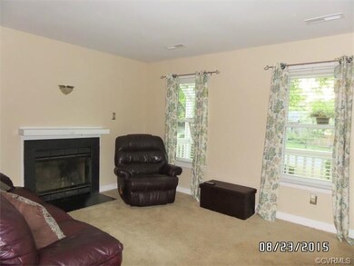 Living Room - 15 x 11.5 - Carpet, Fireplace