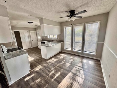 Kitchen featuring dark hardwood / wood-style floor