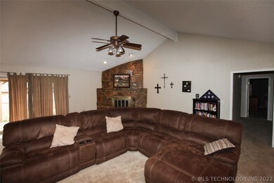 View of stone fireplace in family room.