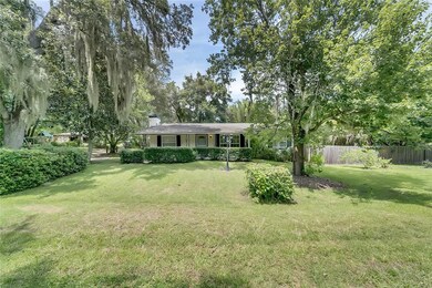 Front view, large front yard with beautiful trees