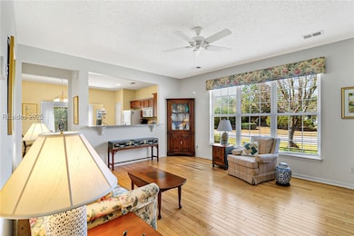Open living area with windows that let tons of nat