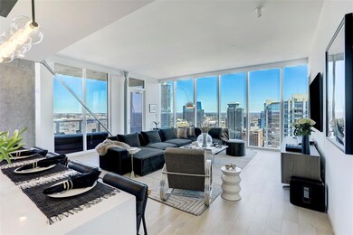 Living room with expansive windows and light wood