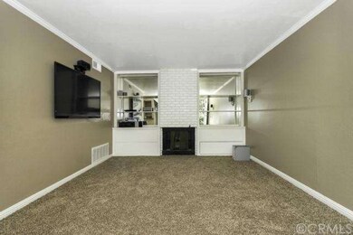 Living room with fireplace, new carpet, baseboards