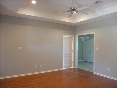 Living Area Featuring wooden floor, trey ceiling ,