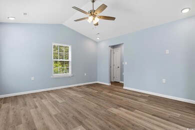 Spare room with hardwood / wood-style flooring, lo