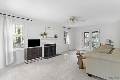 Living room featuring light colored carpet and cei