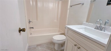 Full bathroom with vanity, washtub / shower combin