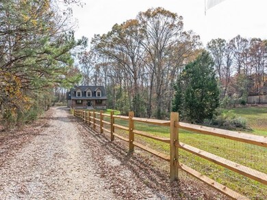Private drive leads you alongside the property