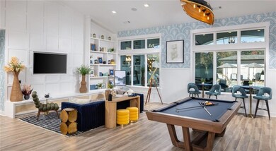 Playroom with wood finished floors and pool table
