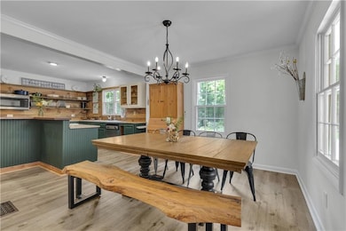 MF- Dining and view of reclaimed kitchen backsplash
