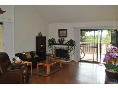 Living room with vaulted ceilings and fireplace