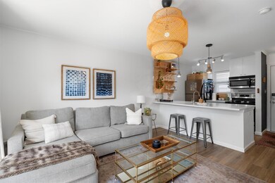 Living room featuring track lighting, baseboards,