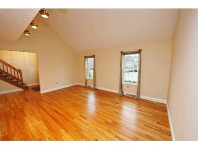 Living Room. Gleaming hardwood floors in this ligh