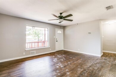 The living area is open with plenty of natural light and a picture window that overlooks the front yard!