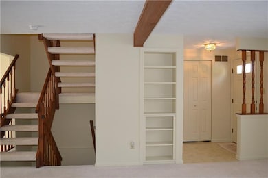Built-in book shelves, and entry hall closet.