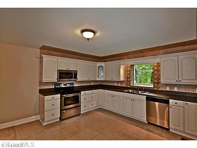 Exterior Front. New kitchen w/tile floors and backsplash