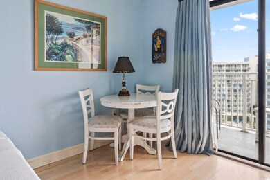 Dining room with healthy amount of natural light, wood finished floors, and baseboards
