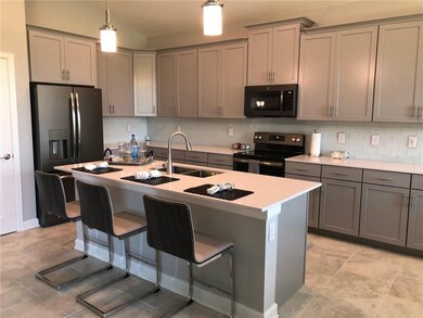 Quartz counters with plenty of counter and cabinet