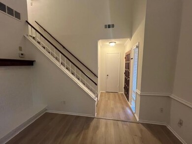 Entrance foyer featuring stairway, visible vents, 