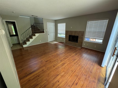 Unfurnished living room with light wood-type floo