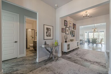 Corridor with visible vents, marble finish floor,
